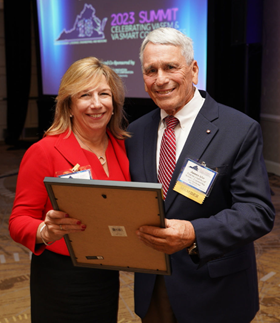 Leidos EVP Vicki Schmanske accepting her election to the  Virginia Academy of Science, Engineering and Medicine from President James Aylor.