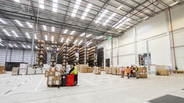 UK DFC logistics warehouse with people working