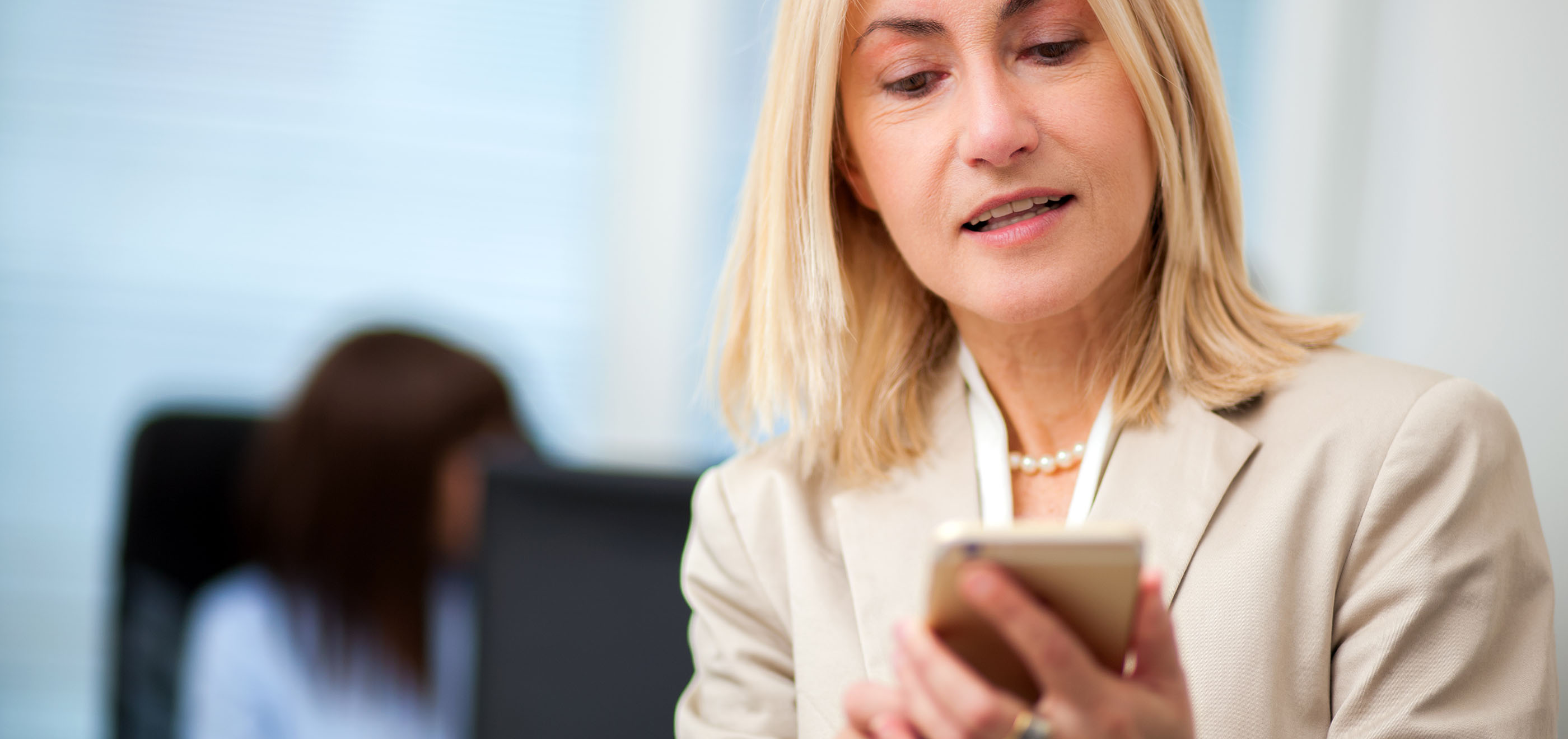 woman typing on cell phone