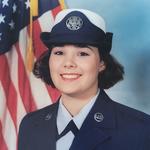 Melissa Tamayo in military uniform in front of the American flag