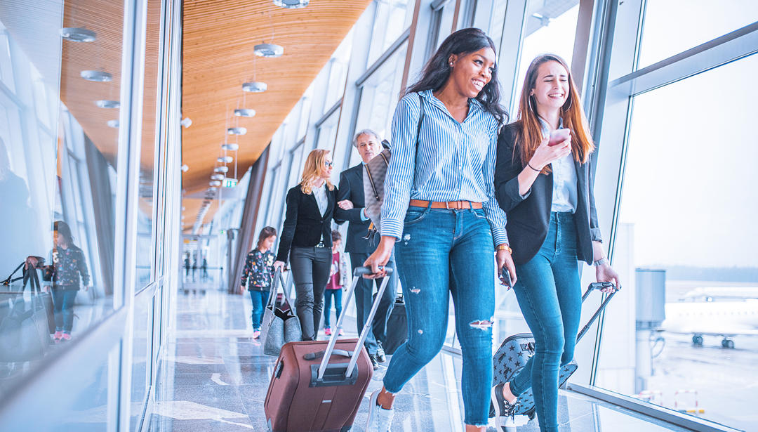 Passengers walking through an airport