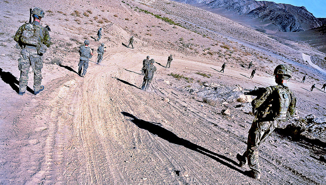military men on dirt road