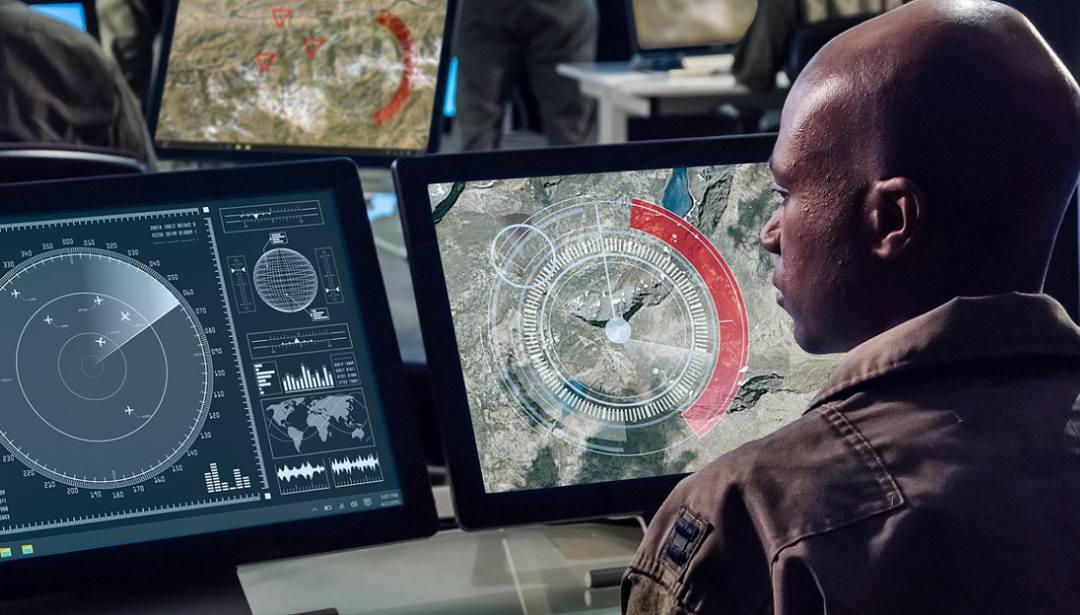 Intelligence analyst at work looking over data