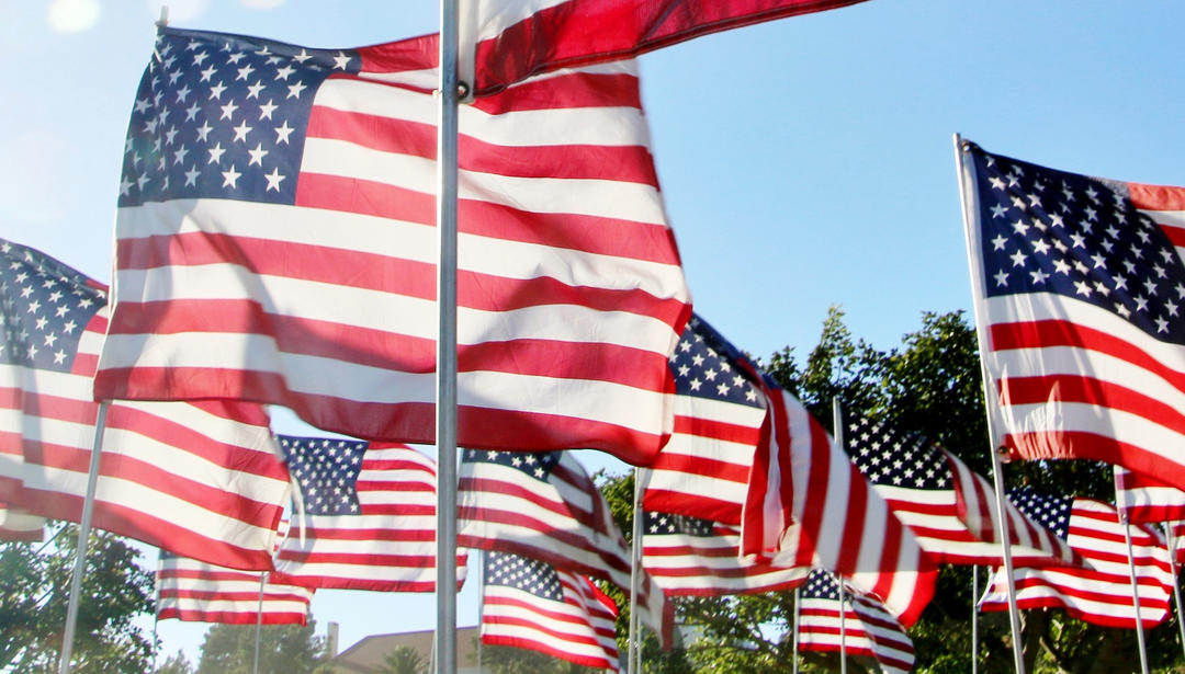 multiple American flags waving