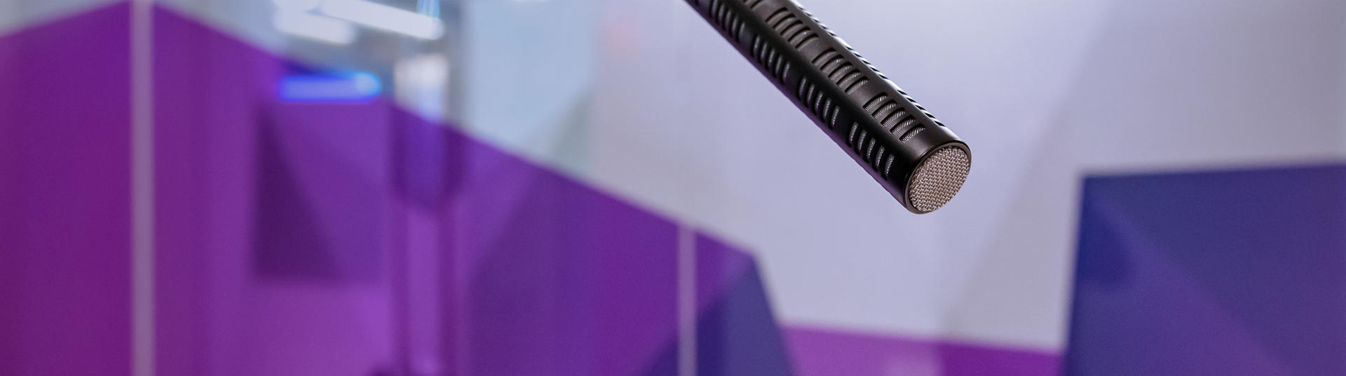 Microphone in front of purple background