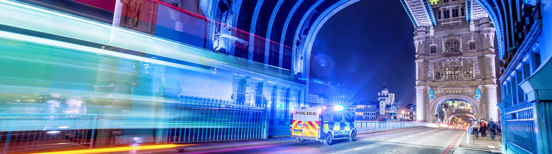 UK police van with lights on Tower Bridge