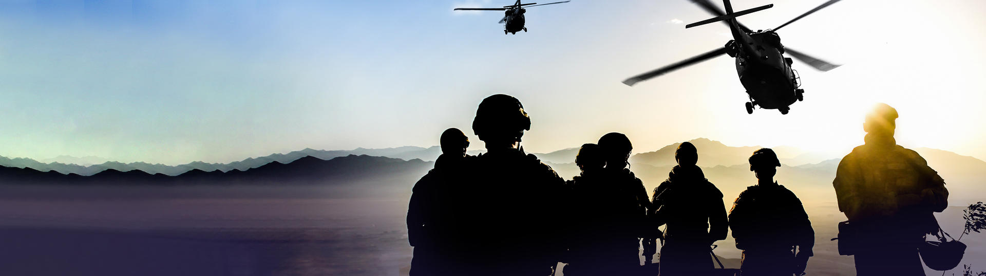 Soldiers with helicopter flying over head
