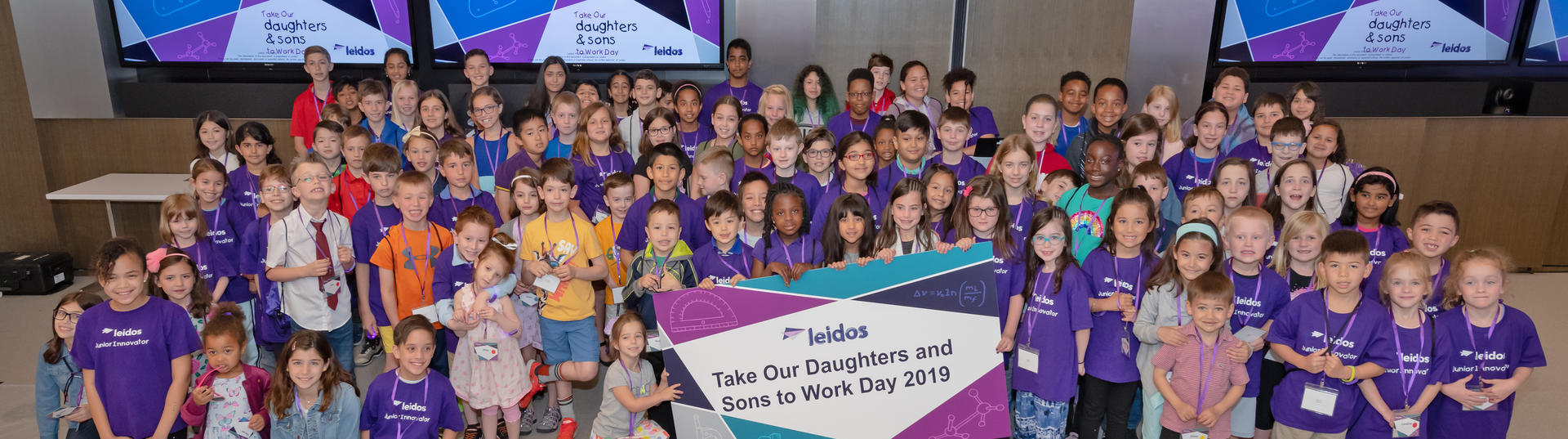 group shot of kids participating in 'take our daughters and sons to work day' event