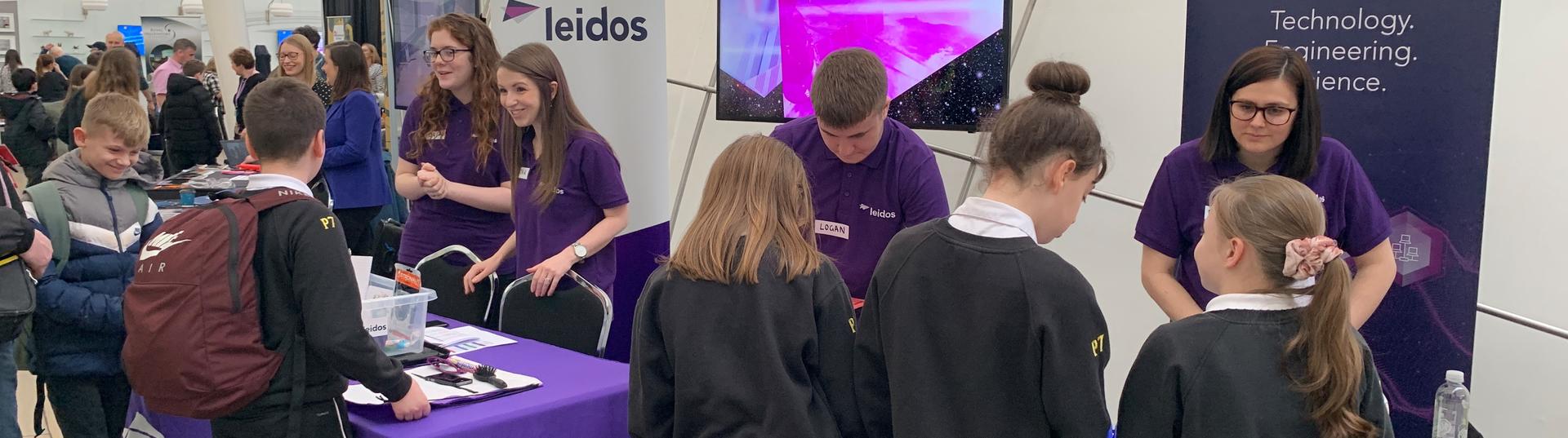 Leidos Stand at STEM event with school kids
