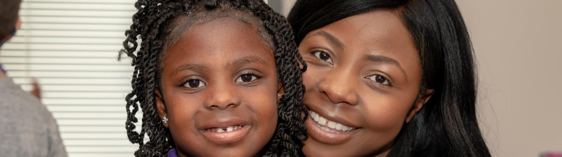 Mother and Daughter attend Take Your Children To Work Day