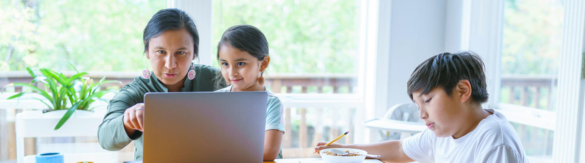 Elementary age boy working on school assignment at home