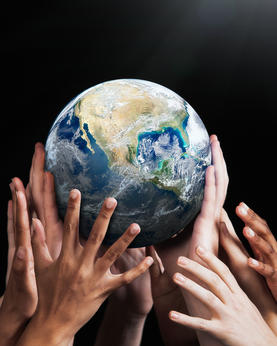 Hands holding Earth globe