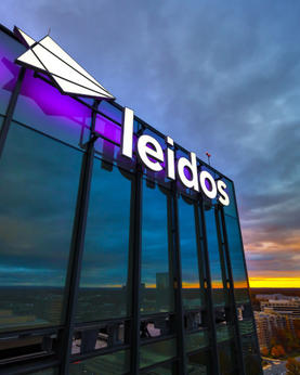 Image of the Leidos HQ Sign on top of the building