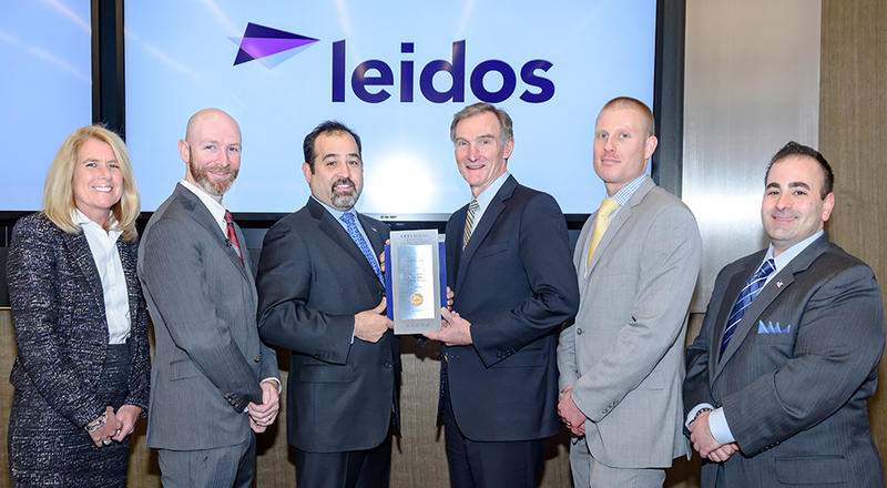 80dd867ccf536ed0e4a8642893a3a603.jpg Leidos accepts an award for making the Best for Vets Index