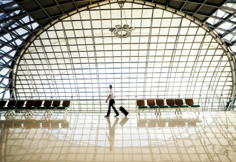 Passenger walking through an airport terminal