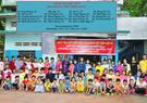 kids in Vietnam in front of school