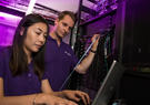 Two Leidos Australia employees operating data servers