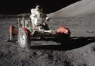 Astronaut driving the Lunar Roving Vehicle on the moon