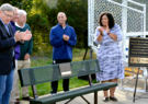 ribbon cutting over dedicated park bench
