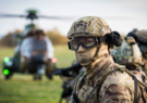 UK Army Soldier with uniform and helicopter in the background