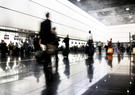 Passengers walking in airport terminal