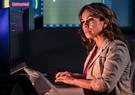 women in cyber lab working on computer