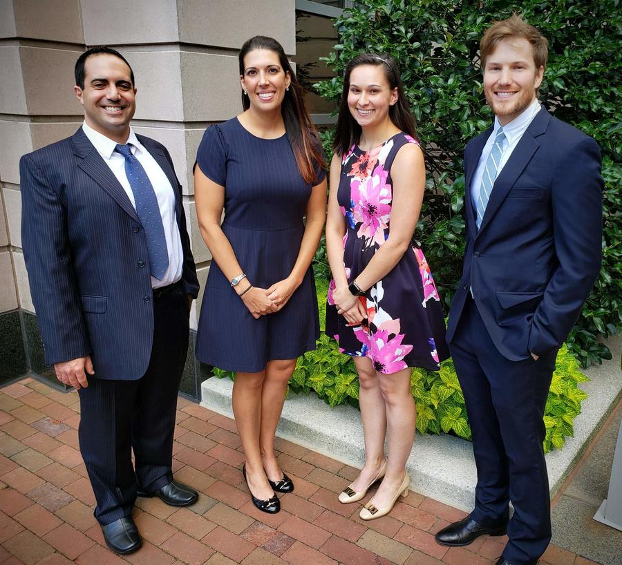 photo of four members of Leidos Tiger Team who worked on robotic process automation