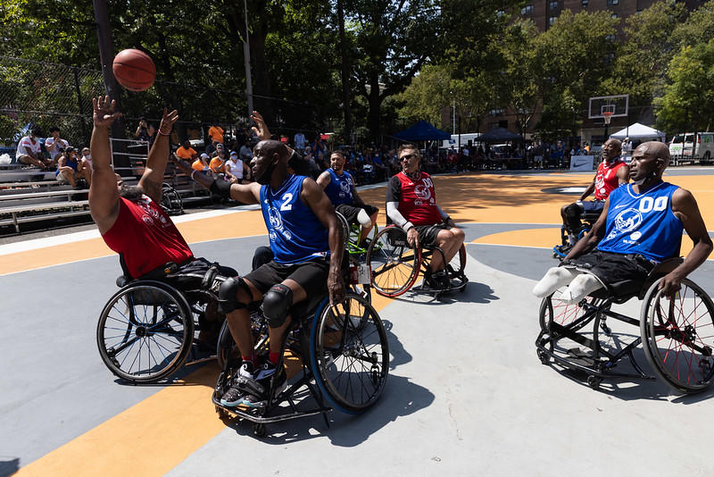 Veterans playing basketball in wheelchairs