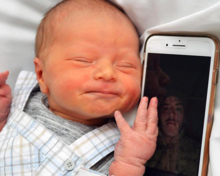 Baby on video chat with deployed father