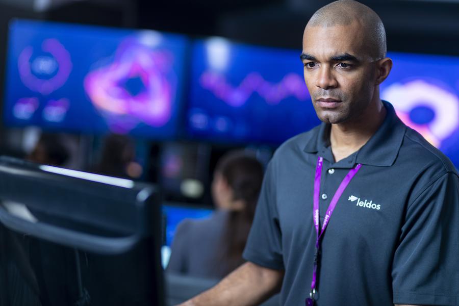 Leidos employee working at desk