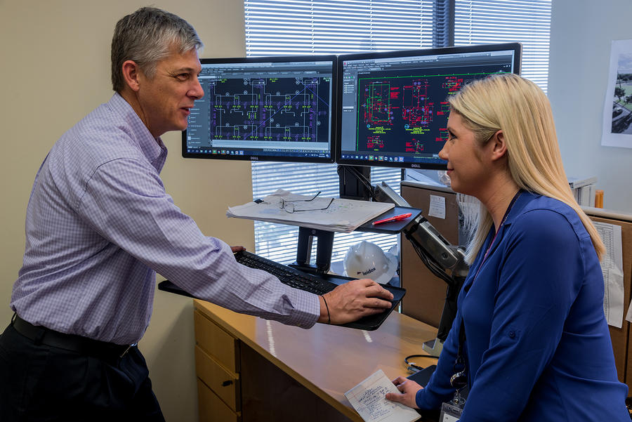 Leidos employees working together 