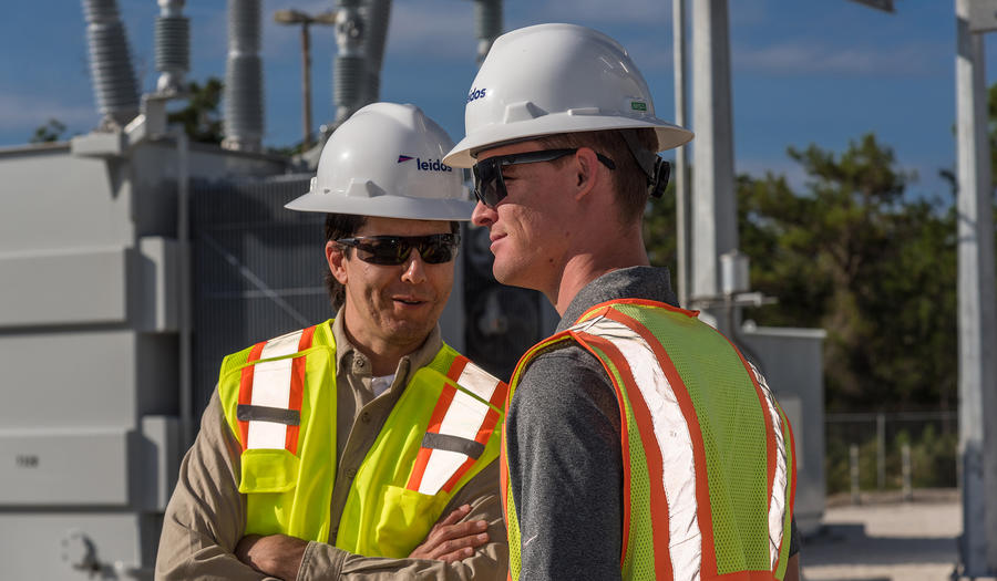 Leidos employees working at substation 