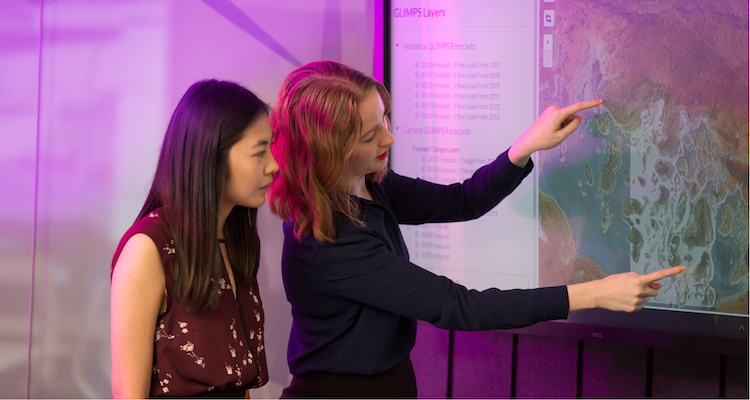 Leidos Australia employees working on touchscreen