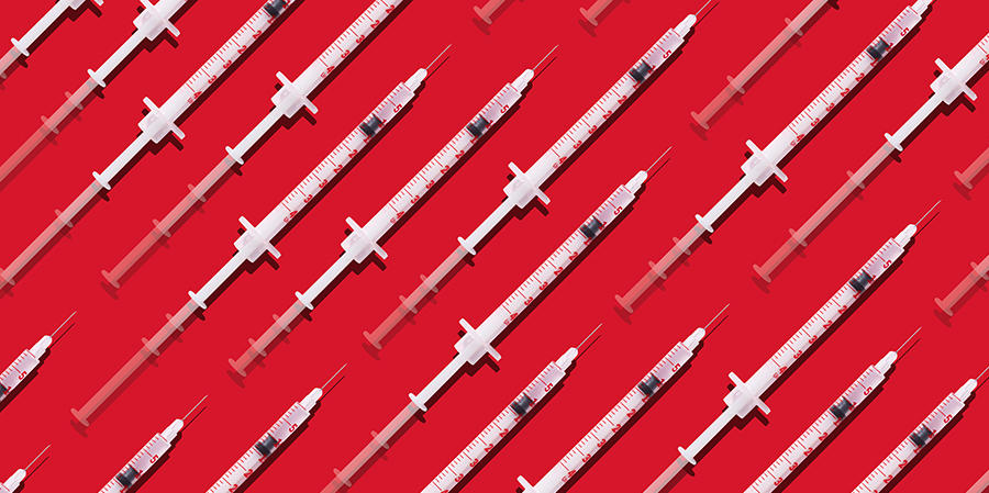 Syringes on red backdrop