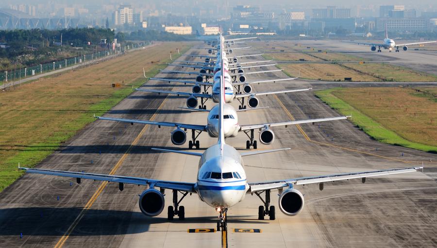 Planes lined up on runway 