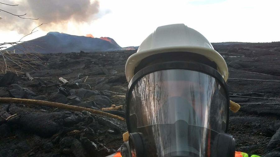 scientist in front of the Kilauea Volcano