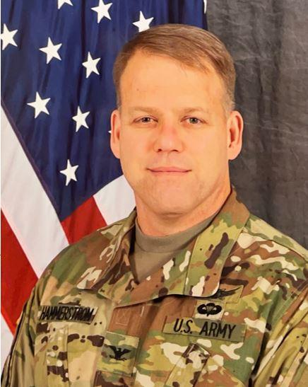 Michael Hammerstrom in uniform pictured in front of an American flag