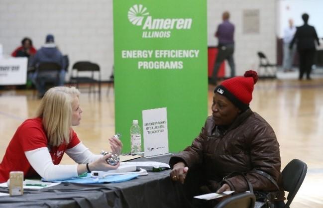 customer learning about energy efficiency programs at an event