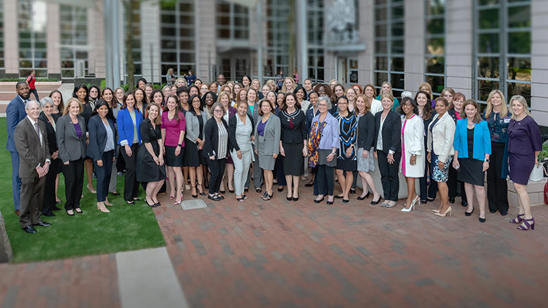 Women's Forum attendees pose for a group photo