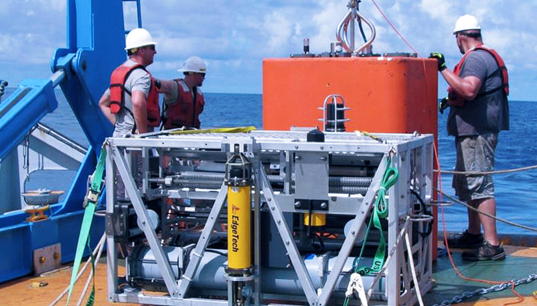 TRAPS system onboard a boat with three men with life vests on