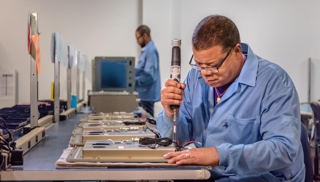 Man assembling product in warehouse