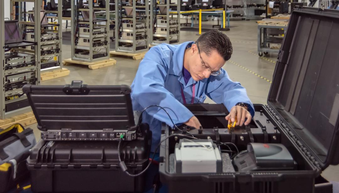 Man working on machine in warehouse