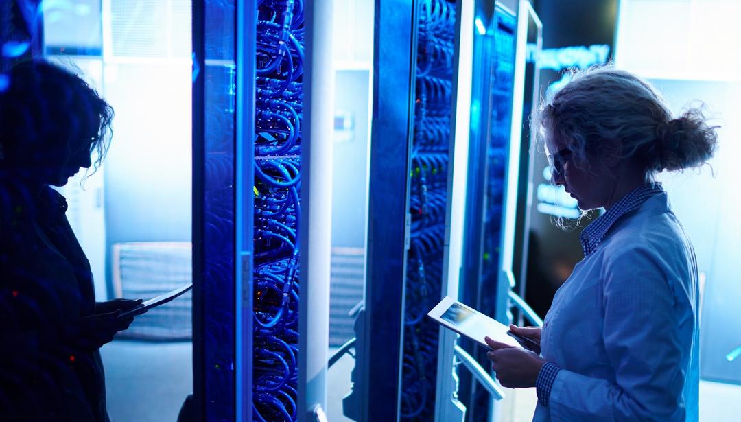 Woman in front of server with tablet