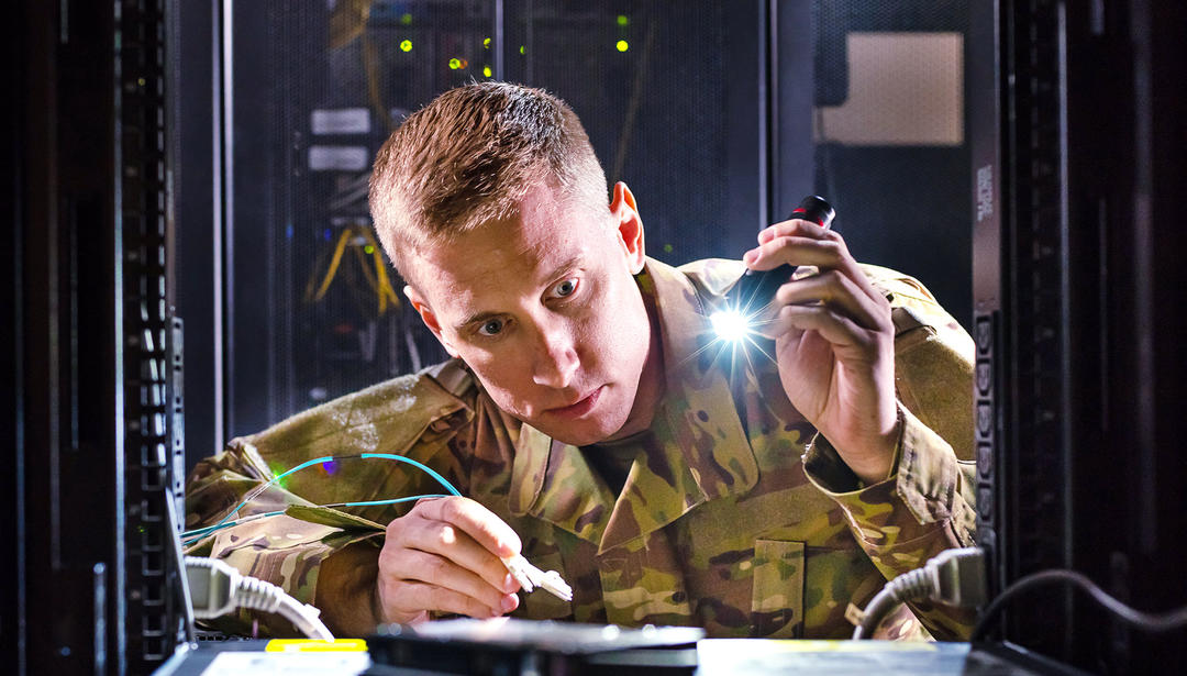man in server cabinet