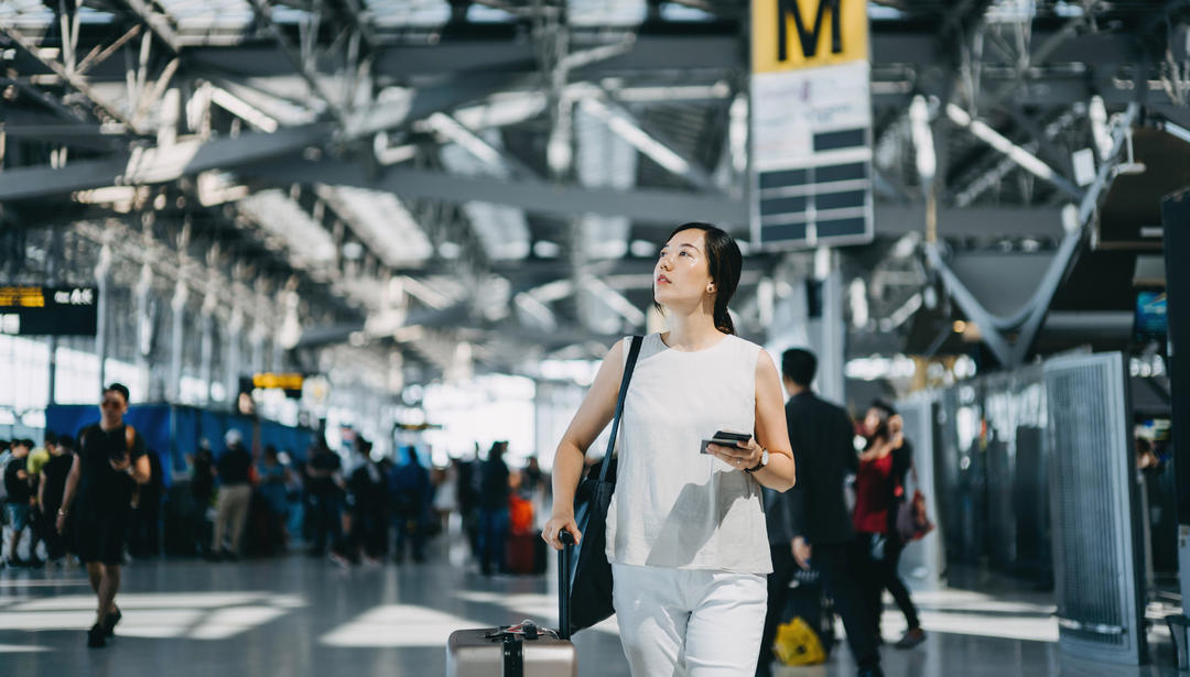 woman walking through airport 