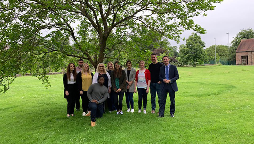 UK group photo under tree