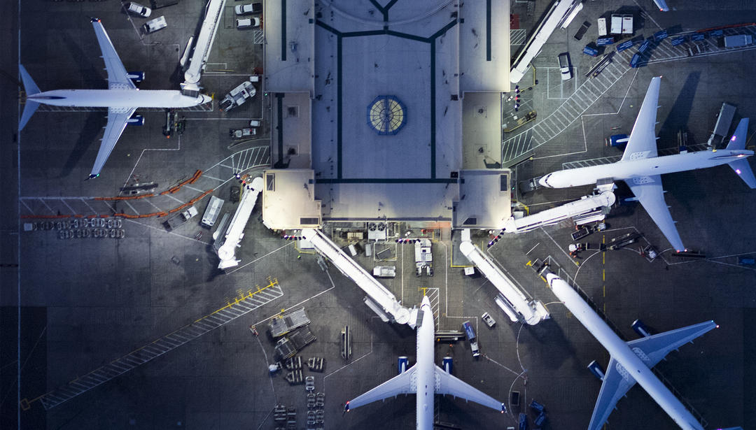 airport terminal gates with planes
