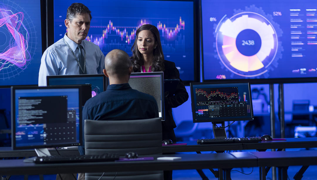 group looking at visual analytics on screens