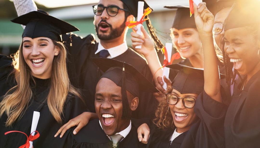 Group of graduates with cap and gown on