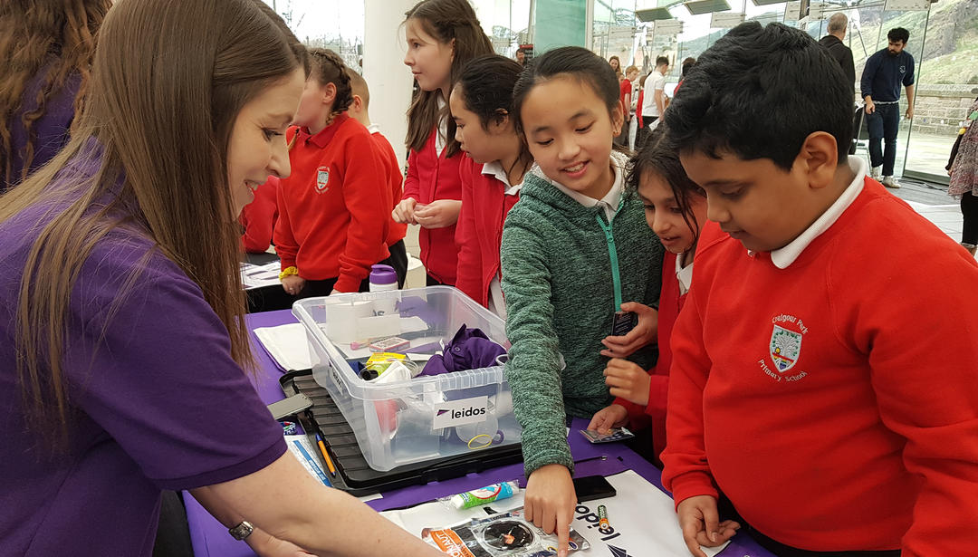 School children at Leidos STEM event taking part in activities